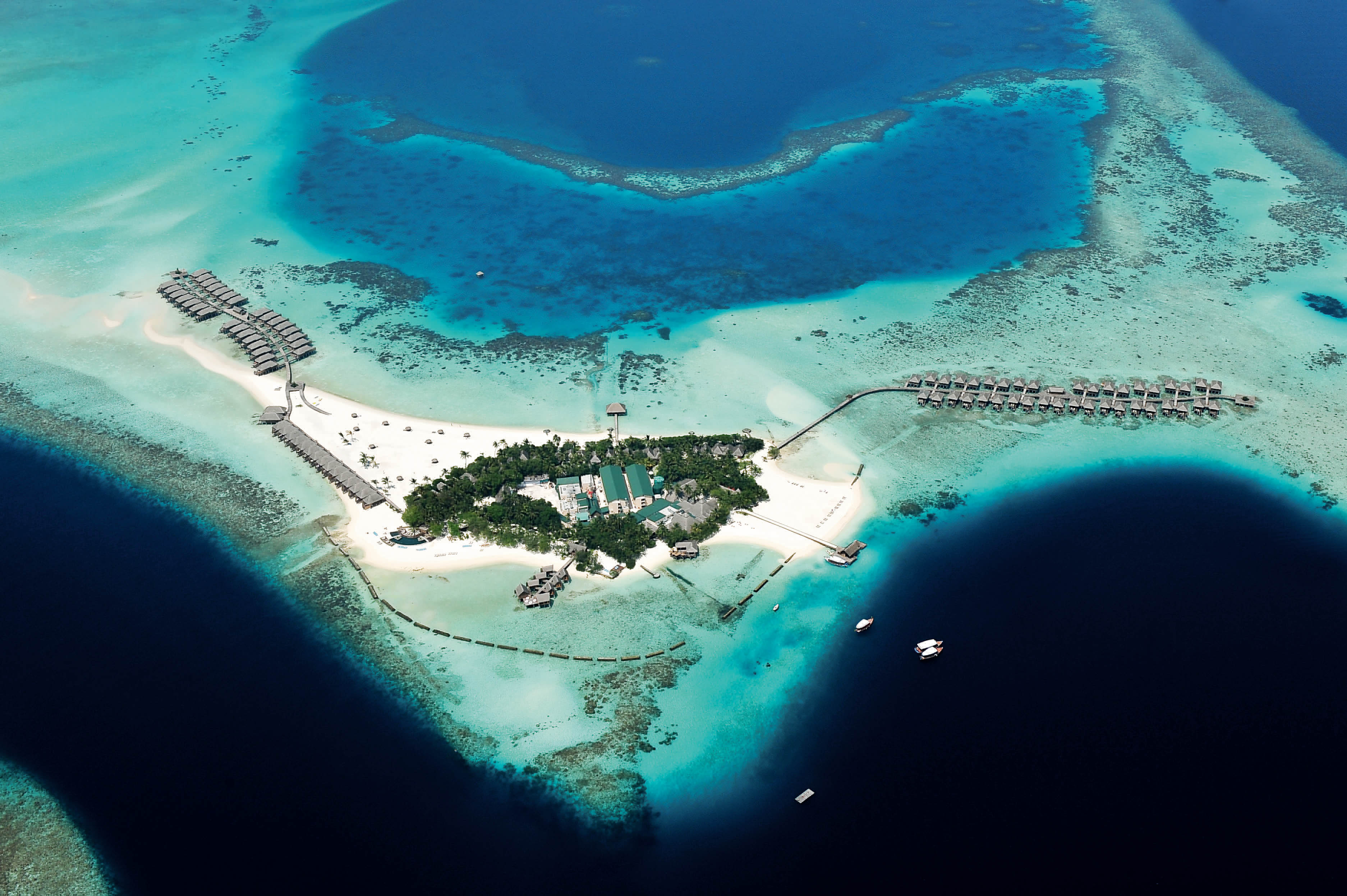 Immagine di sfondo della pagina Constance Moofushi: l'isola gioiello nel cuore blu delle Maldive