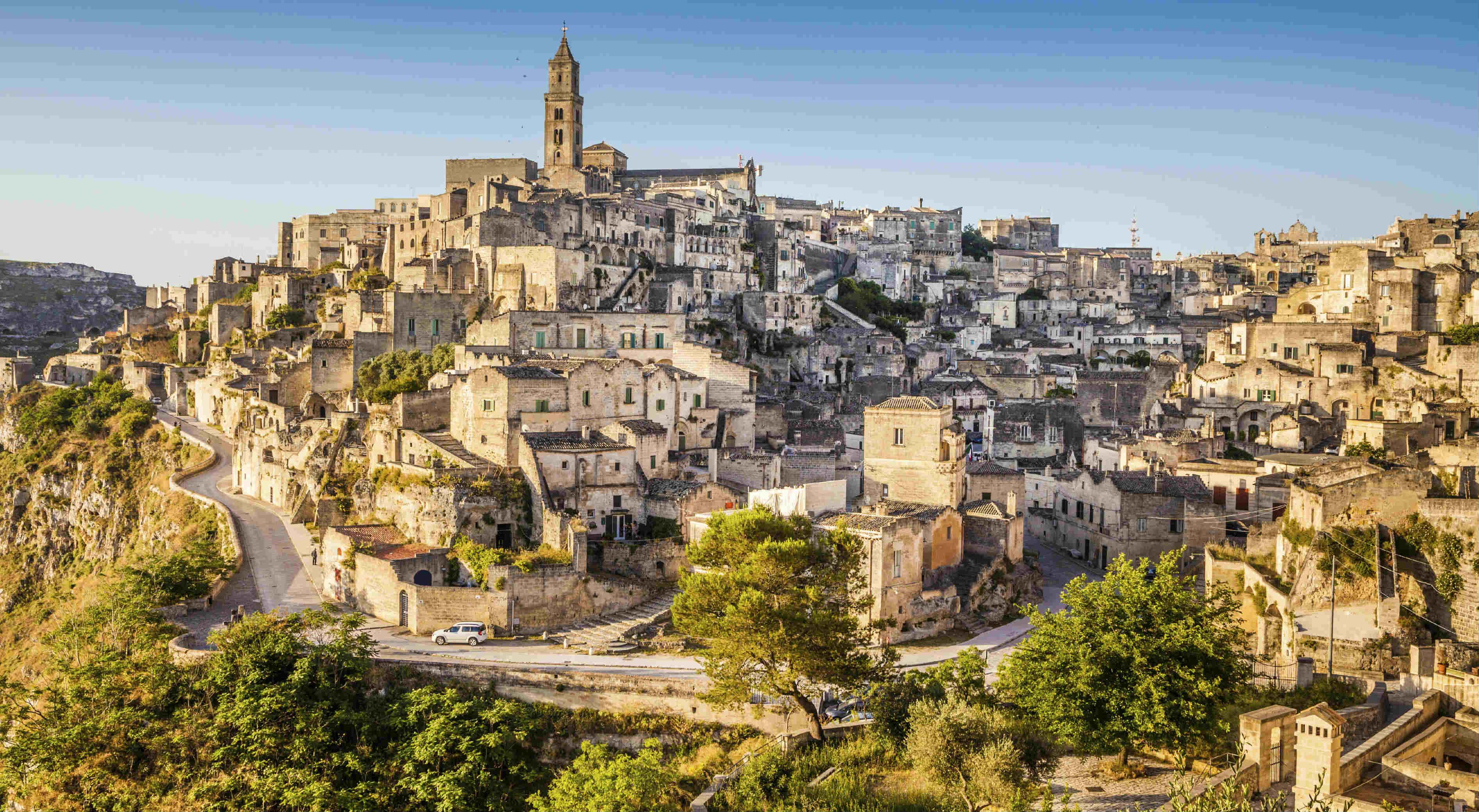 Immagine di sfondo della pagina Matera,con Fucina Madre  artigianato al centro
